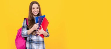 childhood education. child with workbook. student in high school. Portrait of schoolgirl student, studio banner header. School child face, copyspace
