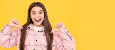 happy kid girl wear pink checkered shirt pointing fingers on herself, selfish. Child face, horizontal poster, teenager girl isolated portrait, banner with copy space