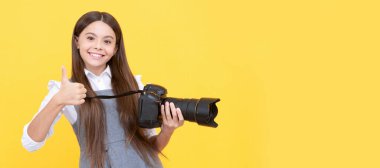 the best. childhood. teen girl taking photo. kid use digital camera. happy child photographing. Child photographer with camera, horizontal poster, banner with copy space
