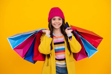 Teenager hold shopping bag enjoying sale. Autumn shopping sale. Child girl is ready to go shopping. Happy teenager, positive and smiling emotions of teen girl