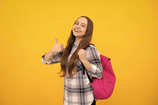 Happy Teen Girl Checkered Shirt Carry Backpack Showing Thumb Yellow — ストック写真