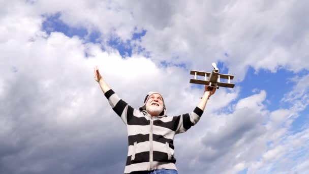 Happy Elderly Man Pretend Flying Toy Airplane Sky Journey — Stockvideo