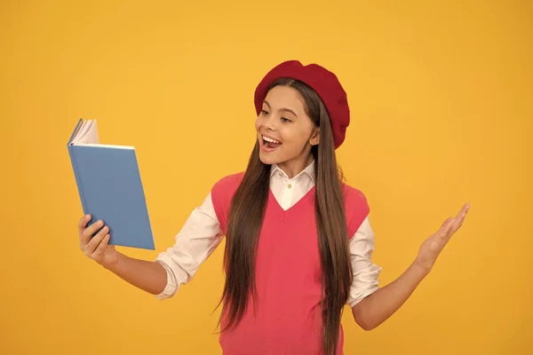 speaker. smiling child reading book. teenage student. learning literature. education. happy french teen girl hold notebook. childhood happiness. back to school. cheerful kid in beret ready to study.