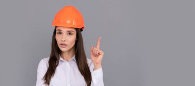 Woman isolated face portrait, banner with mock up copy space. quality inspector. female construction worker. businesslady in builder hardhat