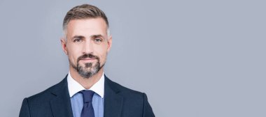 Man face portrait, banner with copy space. business success. grizzled man in businesslike suit. entrepreneur or manager