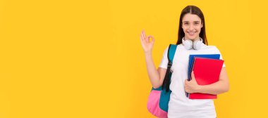 Woman isolated face portrait, banner with copy space. back to school. modern education concept. ok gesture. happy student hold notebook