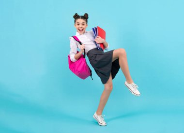 Amazed teenager. School teenager child girl with book and copybook. Teenager student, isolated background. Learning and knowledge. Excited teen girl. Crazy jump and run, jumping kids