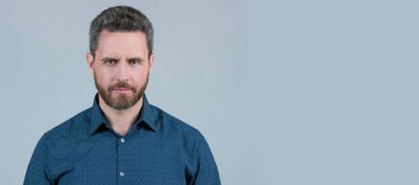 Man face portrait, banner with copy space. Mens salon will help you look your best. Bearded man with stylish haircut. Hair salon. Shaves and facials