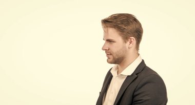 Serious professional man profile portrait in formal suit isolated on white copy space, guy.
