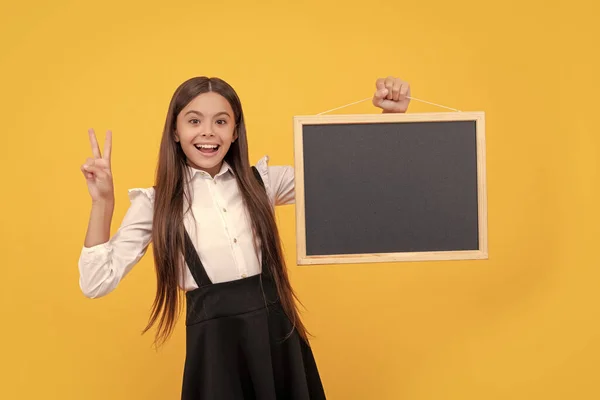 Smiling Teen Girl Uniform Hold School Blackboard Copy Space Showing — Fotografia de Stock