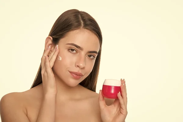 presenting female cosmetic product. woman applying face cream. young girl hold hair mask. lady with skin cream. daily habit and personal care. skincare beauty. beauty cosmetic. cleansing scrub.