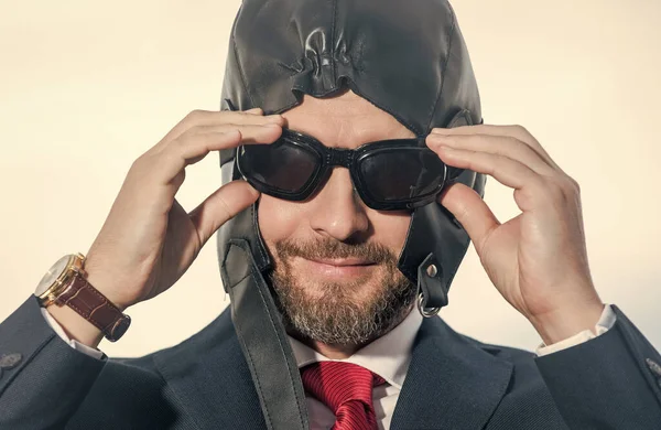 businessman smile in suit and pilot hat get ready.