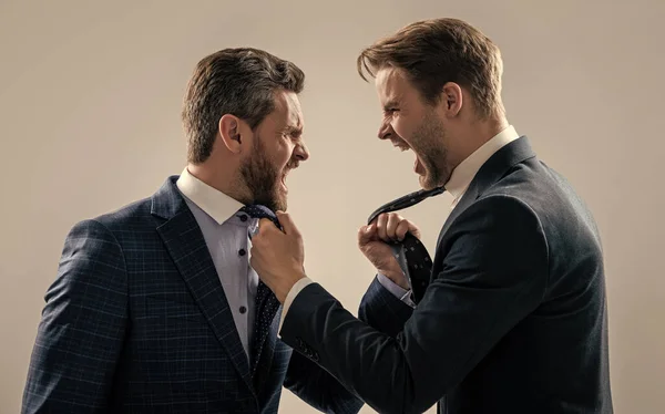 two colleagues have disagreement and conflict. businessmen face to face. disrespect and contradiction. business partners blame each other. arguing businesspeople. dissatisfied men discuss failure.