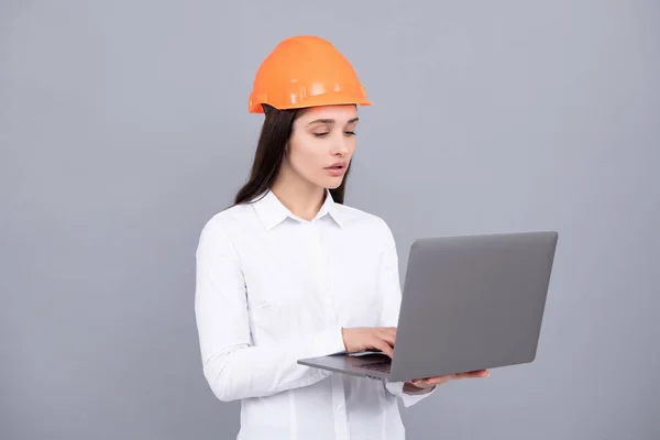 Young Woman Helmet Hold Laptop Computer Gray Background Architect Businesswoman — Stock Fotó