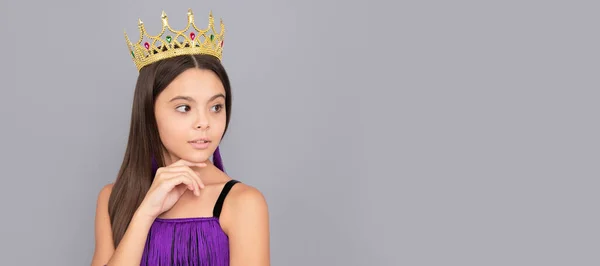 Selfish girl wear luxury prom queen crown grey background, dream big. Child queen princess in crown horizontal poster design. Banner header, copy space
