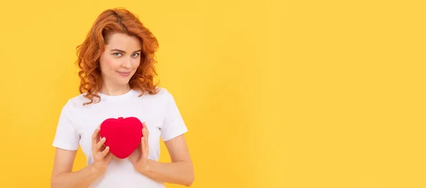 portrait of girl with heart. happy valentines day. be my valentine. lady on yellow background. Woman isolated face portrait, banner with copy space