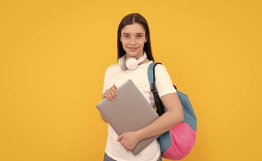 cheerful lady in headphones hold pc carry backpack, school.