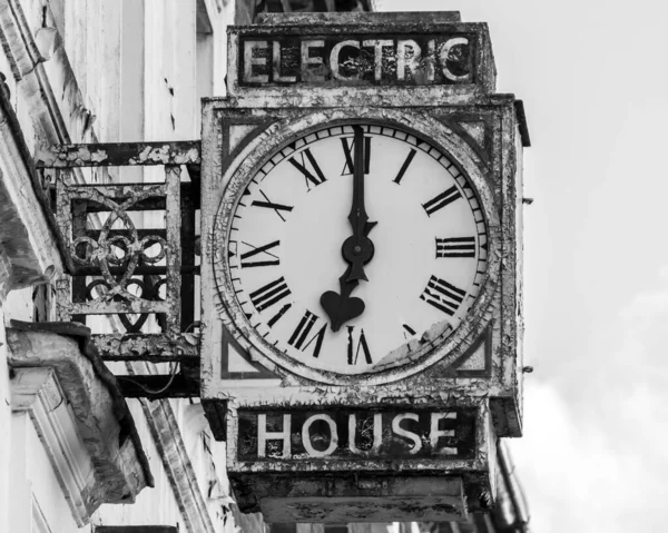 Vintage rusty electric house wall clock A, black and white high contrast photography autumn season 2021