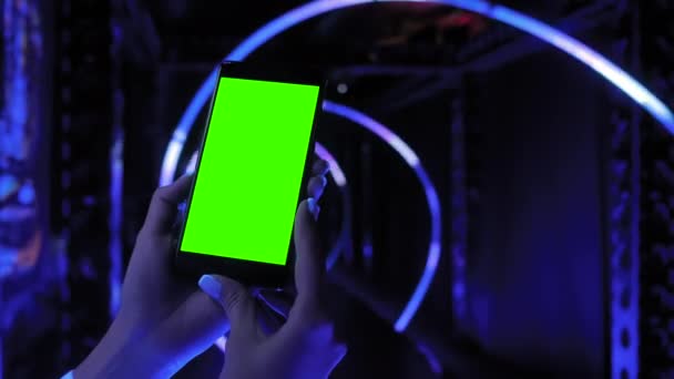 Woman using smartphone device with green display - close up — Stock Video
