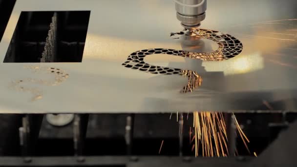 CNC laser cutting machine making holes in sheet metal with sparks - slow motion — Stok video