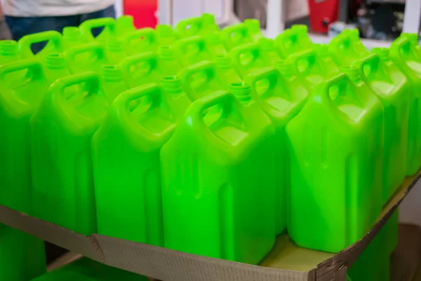 Many empty green plastic jerrycans