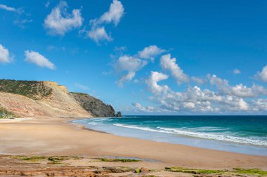 Beach and rocky coast of Praia da Luz in the Algarve in Portugal