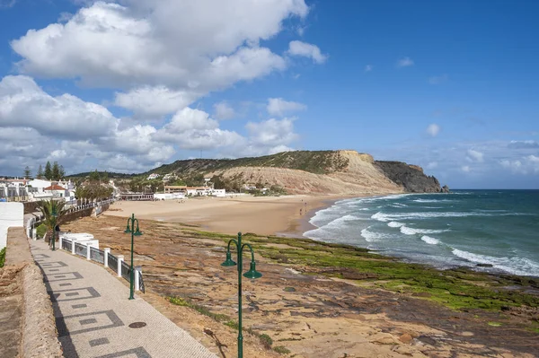 Waterfront of Praia da Luz in the Algarve. In the background the rocky coast with beach