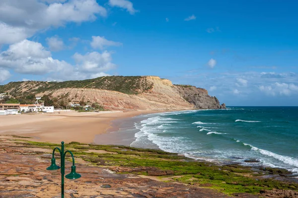Beach and rocky coast of Praia da Luz in the Algarve in Portugal