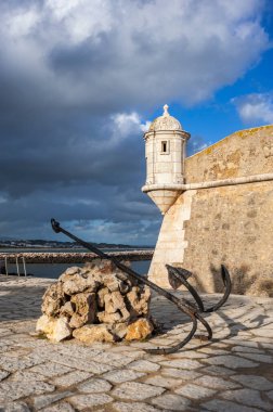 Corner tower of the historic Forte da Ponta da Bandeira fortress in Lagos in the Algarve in Portugal