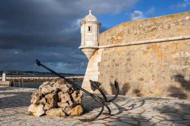 Corner tower of the historic Forte da Ponta da Bandeira fortress in Lagos in the Algarve in Portugal