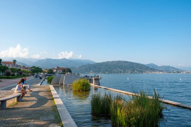 Baveno, Italy - August 15, 2018: Promenade in Baveno with Lago Maggiore. Baveno is a town in Piedmont in northern Italy
