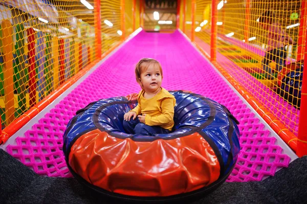 Baby Girl Sitting Tubing Donuts Enjoying Slides Fun Children Center — Stock Photo, Image