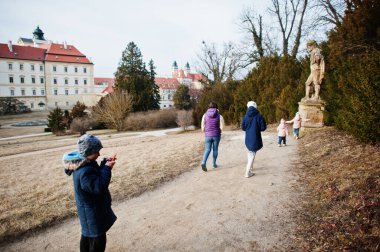 Mother with four kids at Valtice Palace, Czech Republic.