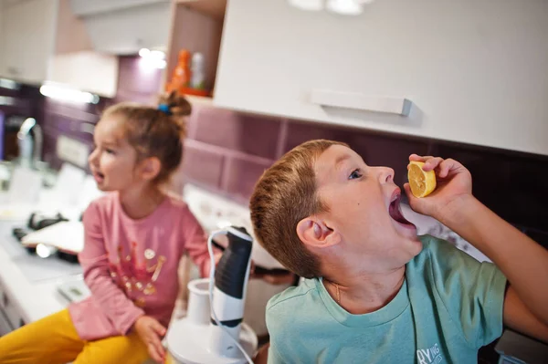 Kids Cooking Kitchen Happy Children Moments Boy Eat Lemon — Stock Fotó