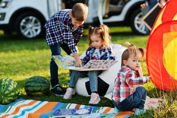 Family Spending Time Together Girl Reading Book Outdoor Brother Sister — 스톡 사진