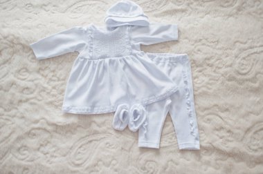 Snow white baby clothes for the rite of baptism.