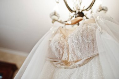 Wedding dress hanging ceiling. Bride day. 