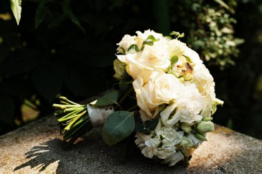 Beautiful tender wedding bouquet and rings. 