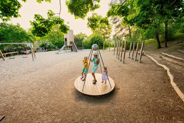 Three Kids Rides Playground Centrifuge Swing Children — Stock Photo, Image