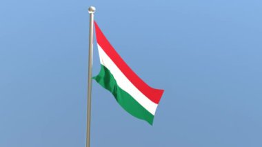 Bayrak direğinde Macar bayrağı. Rüzgarda dalgalanan Macaristan bayrağı.
