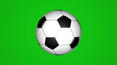 Klasik futbol topu yeşil arka planda döner. Krom anahtar.