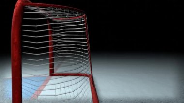 Hokey golü. Disk buz pistindeki kaleye doğru uçuyor. Bahis terfisi için uygun spor konsepti.