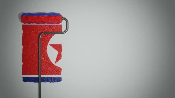 ローラーは北朝鮮の旗の色で壁をペイントします 旅行のコンセプト 北朝鮮 北朝鮮 — ストック動画