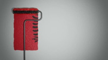 Patenci, duvarı Arnavut bayrağına boyuyor. Seyahat konsepti. Arnavutluk.