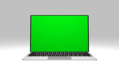 Yeşil ekran görüntülü gri laptop. Reklam için yeri olan bir defter. Kişisel bilgisayarın ekranında Chromakey alanı.