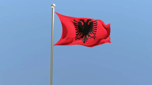 Albanian flag on flagpole. Albania flag fluttering in the wind. National flag.