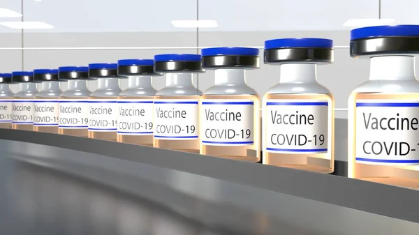 Vaccine production. Many Covid-19 vaccine vials in production. Factory. Vaccination.