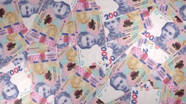 200 Ukrainian hryvnia money composition. Financial background. Many banknotes and wads of money. Business or economy concept. Cash.