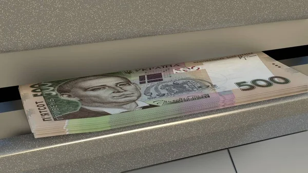 500 Ukrainian hryvnia in cash dispenser. Withdrawal of cash from an ATM. Financial transaction in the bank terminal. UAH.