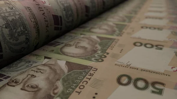 500 Ukrainian hryvnia bills on money printing machine. Illustration of printing cash. Banknotes. UAH. Economy.